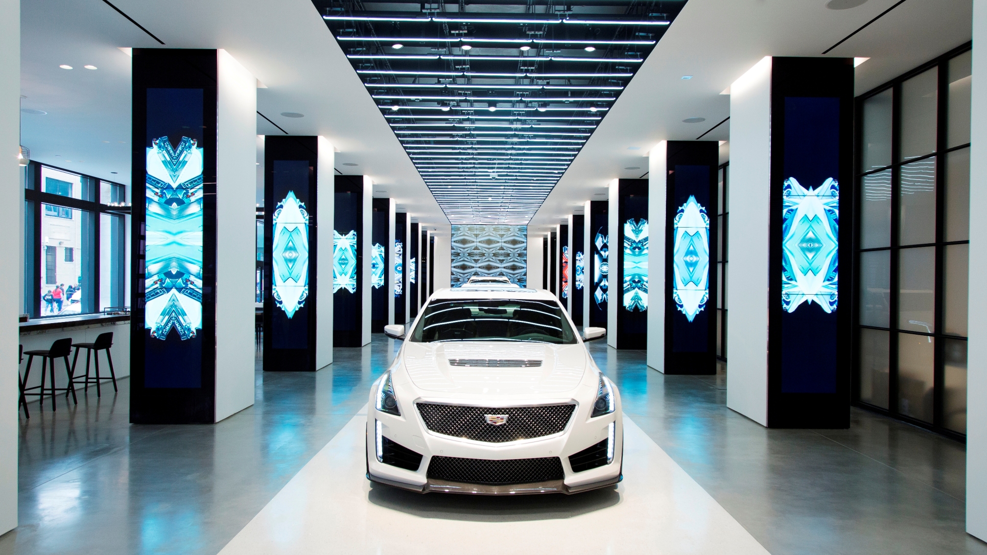 CTS-V, CT6, and XT5 vehicles will be stationed on the runway inside. Copyright Gensler